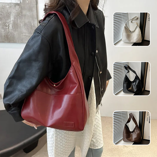 Sac femme porté rouge et noir en similicuir